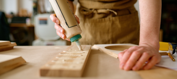 Woodworker using glue on products -