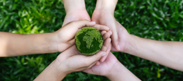 Environmentally friendly concept, hands holding green earth -